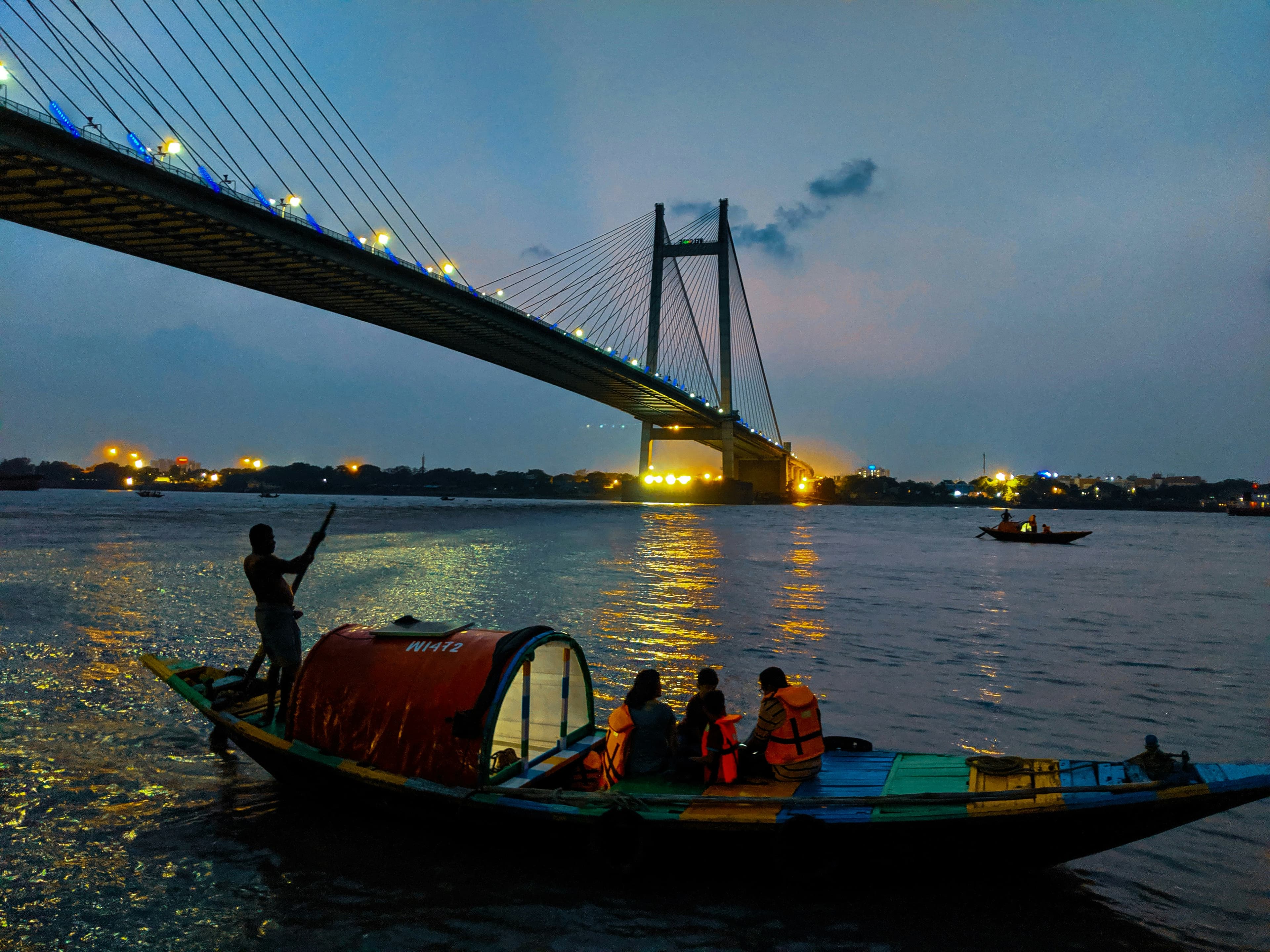 Traditional boat beneath Vidyasagar Setu on the Hooghly